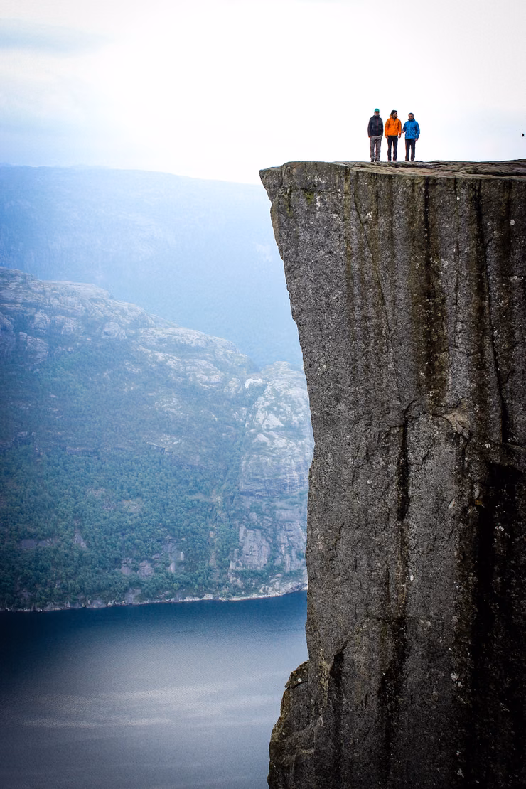 Group of people on a hike at the top of a mountain