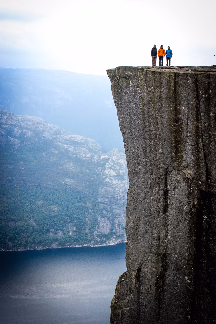Group of people on a hike at the top of a mountain