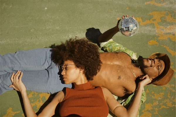 Woman and man laying in the sun