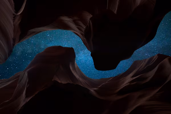 The sky above seen from the bottom of a deep canyon