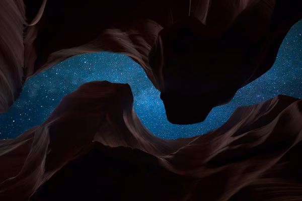 The sky above seen from the bottom of a deep canyon