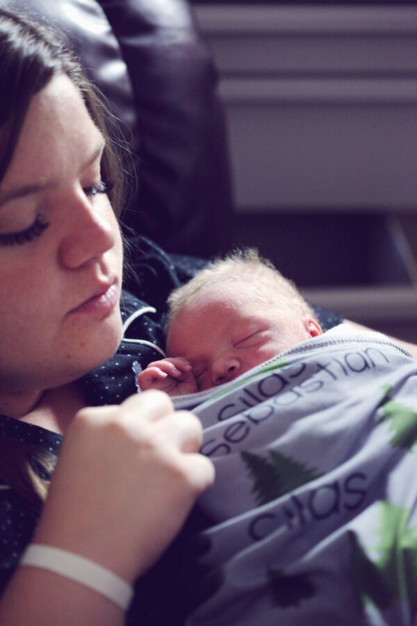 Baby sleeping on mother