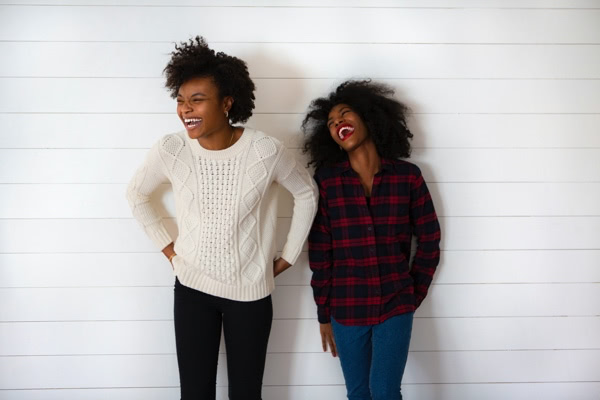 Two women smiling together